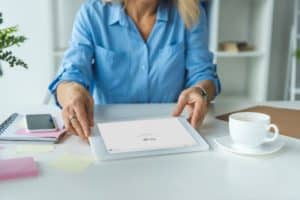 cropped view of businesswoman using digital tablet with Google website